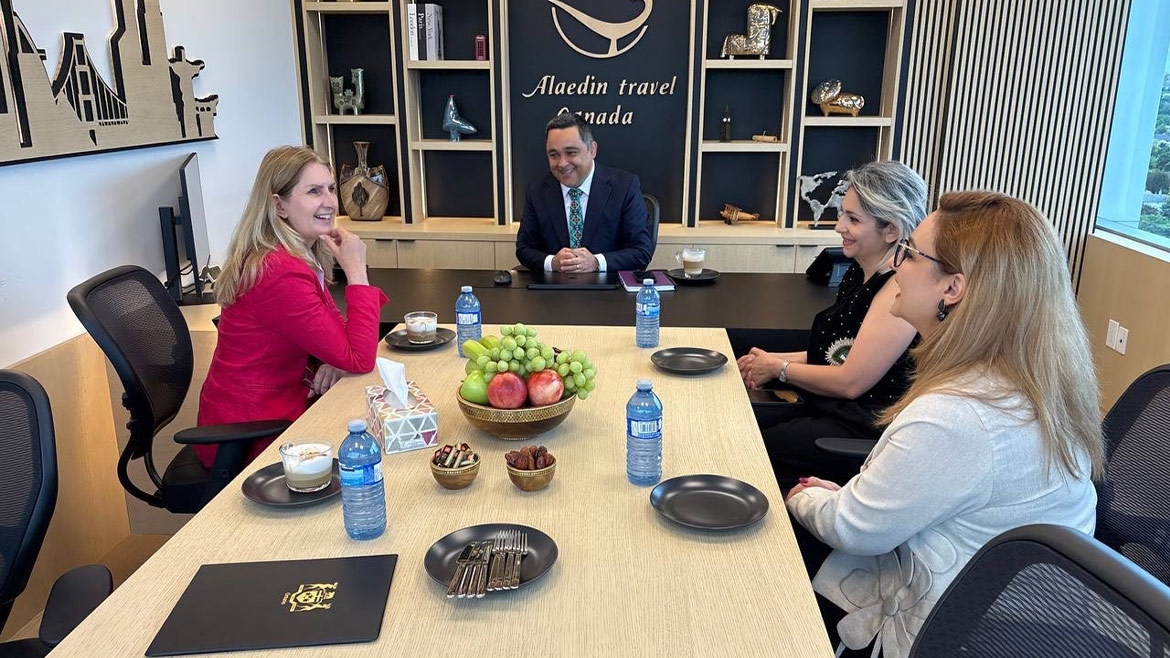 Alaedin Travel Canada representatives and guests meeting at the company's Thornhill office during an official visit.