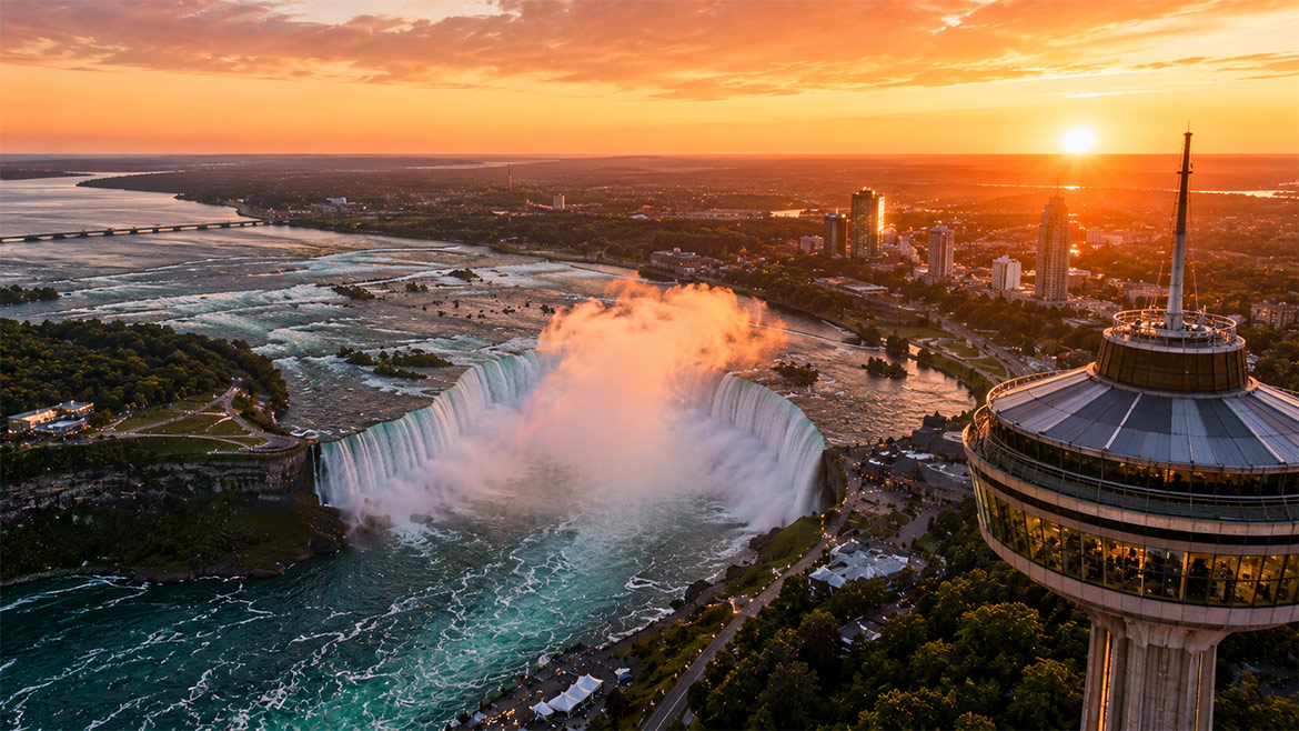 Aerial sunset view of Horseshoe Falls and Skylon Tower in Niagara Falls Canada