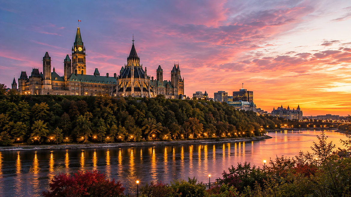 Parliament Hill overlooking the Ottawa River at sunset